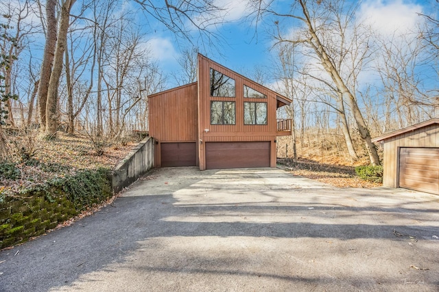 view of side of property featuring a garage