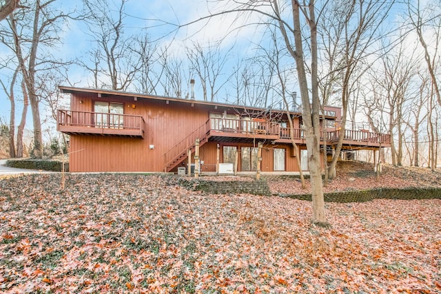 rear view of property featuring a deck