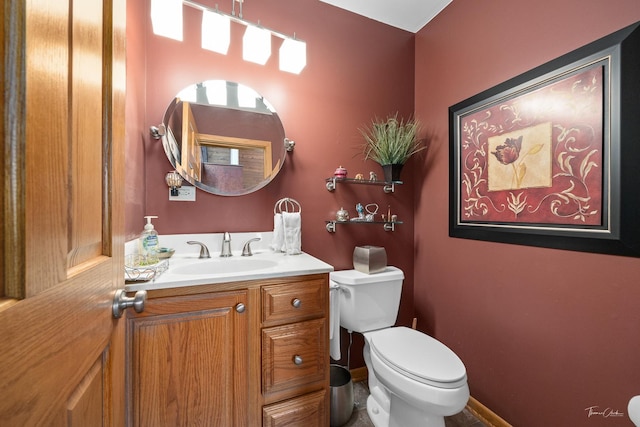 bathroom with vanity and toilet