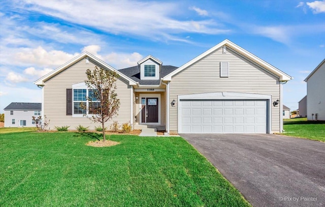 view of front of house featuring a garage and a front lawn