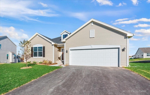 view of front facade with a garage and a front yard