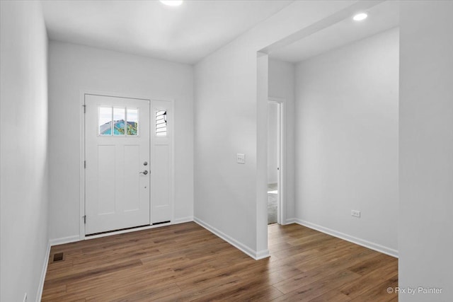 entrance foyer featuring hardwood / wood-style flooring