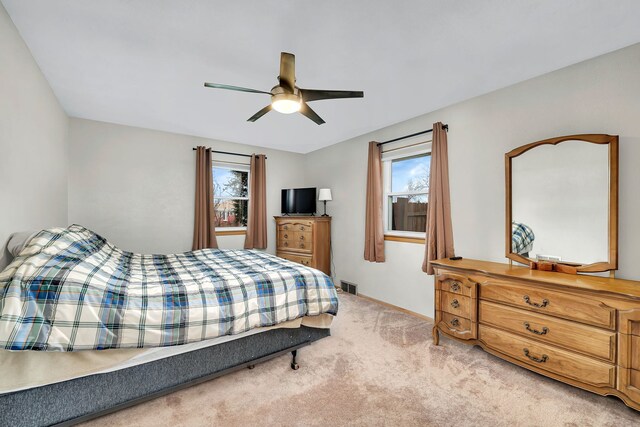 carpeted bedroom featuring ceiling fan