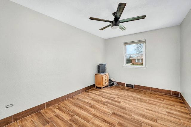 empty room featuring ceiling fan and light hardwood / wood-style floors