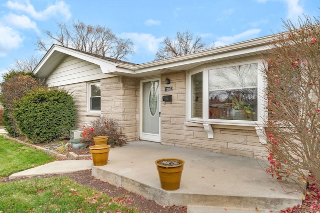 entrance to property with a patio