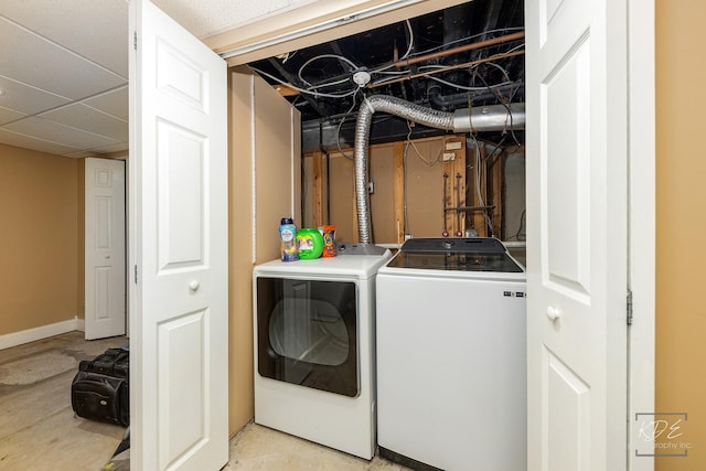 washroom featuring washing machine and clothes dryer