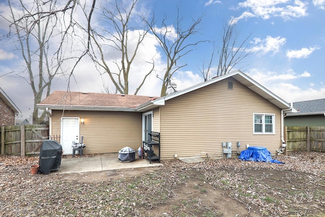 back of house with a patio