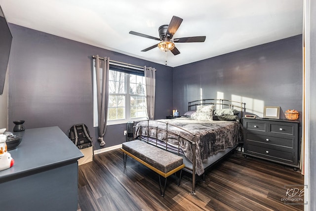 bedroom with ceiling fan and dark hardwood / wood-style flooring