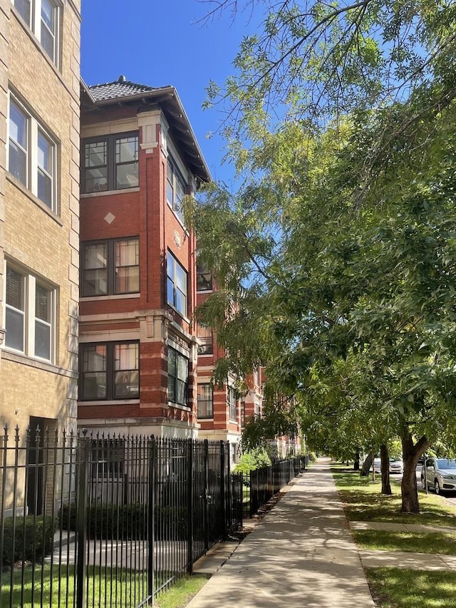 view of community featuring a fenced front yard