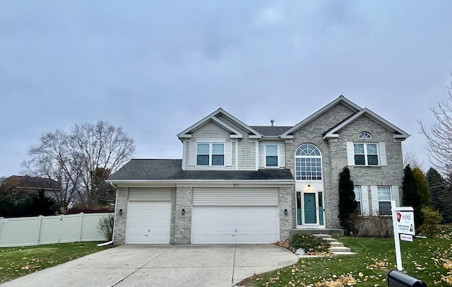 front of property with a garage and a front yard