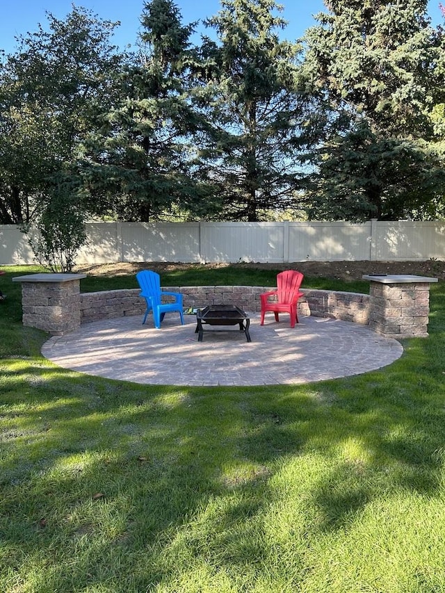 view of yard with a patio area and a fire pit