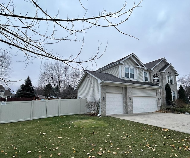 view of home's exterior with a garage and a lawn