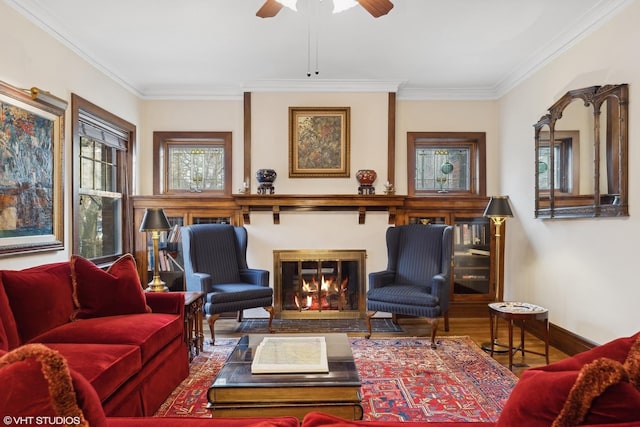 sitting room with ornamental molding, wood-type flooring, and ceiling fan