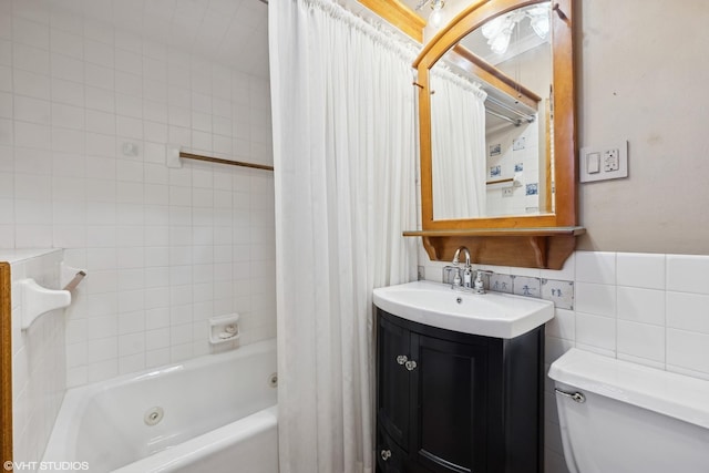 full bathroom with vanity, tile walls, shower / bathtub combination with curtain, and toilet