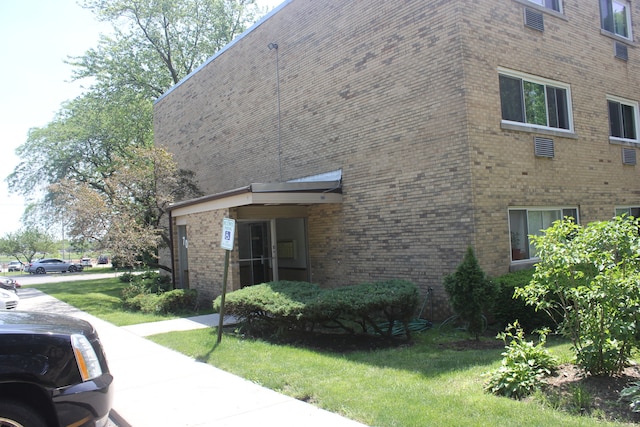 view of home's exterior featuring a lawn