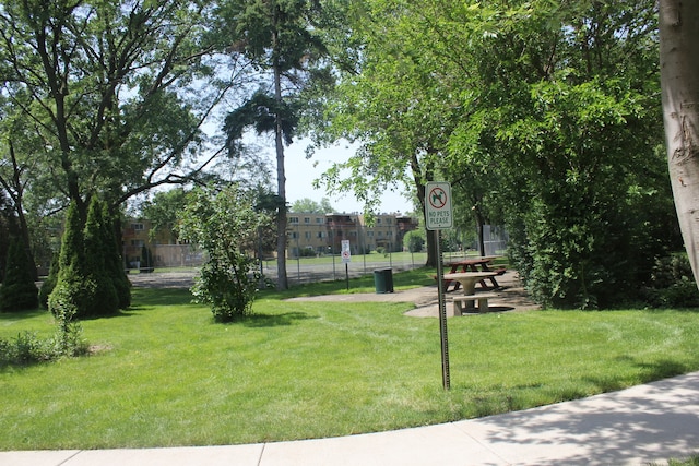 view of home's community with a lawn