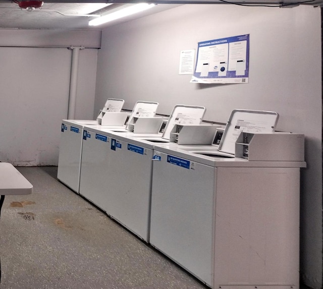 clothes washing area featuring separate washer and dryer