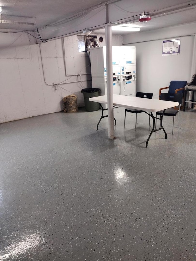 basement with white fridge with ice dispenser