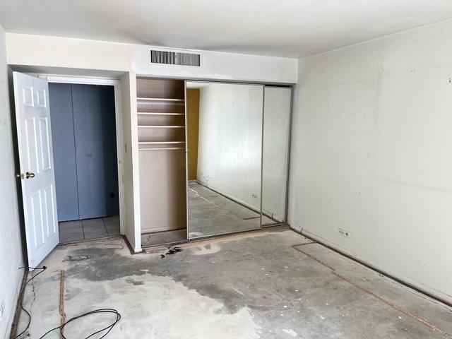 unfurnished bedroom featuring a closet