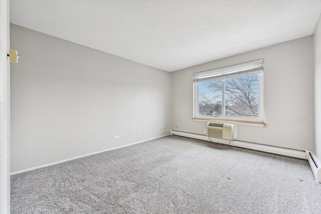 carpeted spare room with a textured ceiling and a baseboard radiator