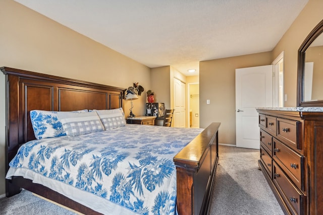 carpeted bedroom with a closet