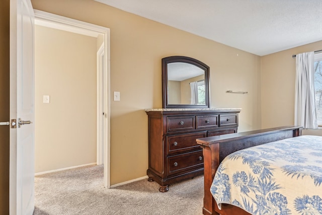 bedroom with light colored carpet