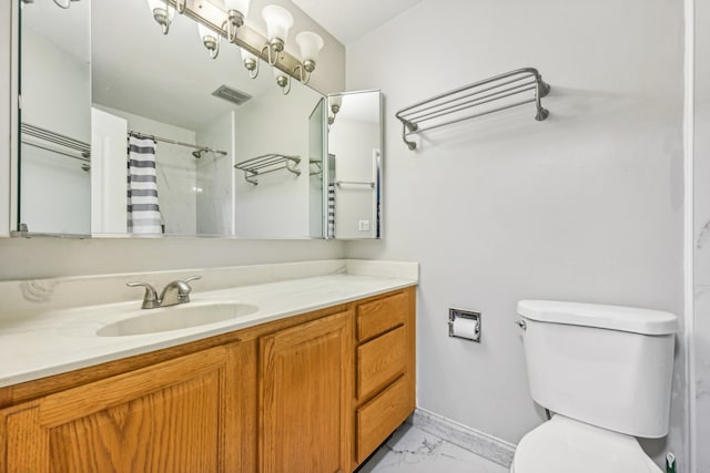 bathroom with vanity, a shower with shower curtain, and toilet