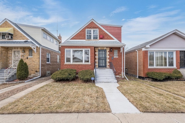 bungalow-style home with a front lawn