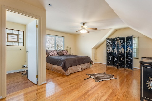 bedroom featuring lofted ceiling, hardwood / wood-style flooring, and ceiling fan