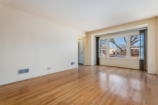 unfurnished room with light hardwood / wood-style floors