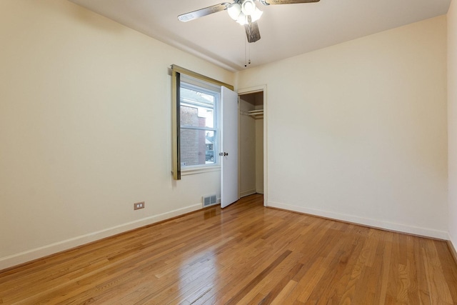 unfurnished room featuring ceiling fan and light hardwood / wood-style flooring