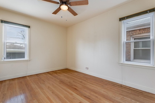 spare room featuring ceiling fan and light hardwood / wood-style flooring