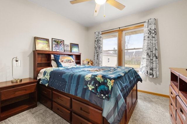 bedroom featuring light colored carpet and ceiling fan