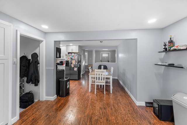 dining area with dark hardwood / wood-style flooring