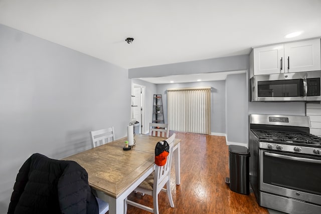 dining room with dark wood-type flooring