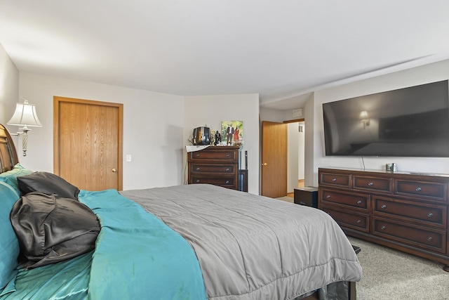 carpeted bedroom with a closet