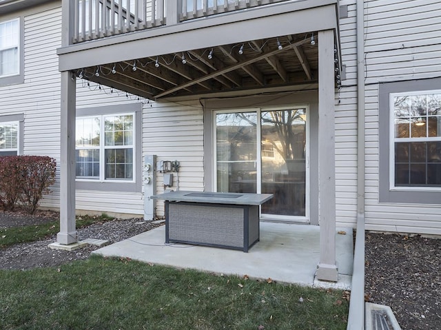 view of patio featuring a balcony