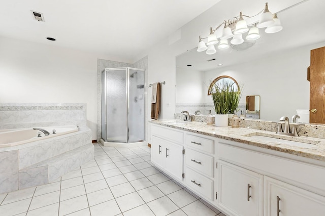 bathroom featuring vanity, shower with separate bathtub, and tile patterned floors