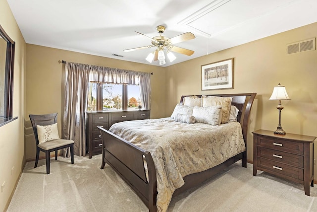 bedroom with ceiling fan and light carpet