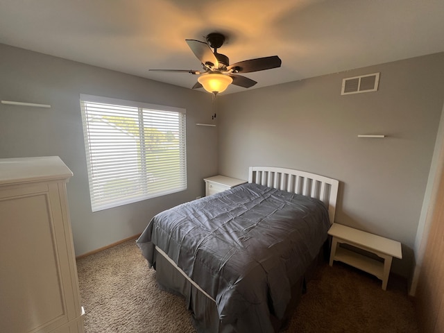 bedroom featuring light colored carpet and ceiling fan