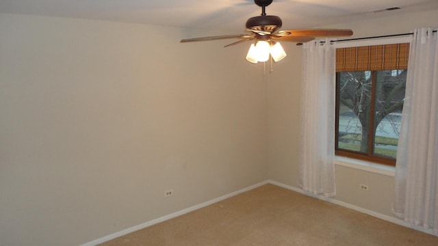 carpeted empty room with ceiling fan