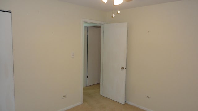 empty room featuring light carpet