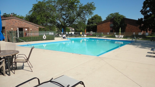 view of swimming pool with a patio