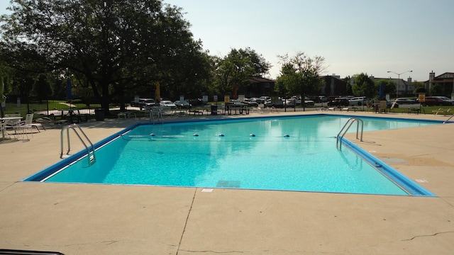 view of swimming pool with a patio