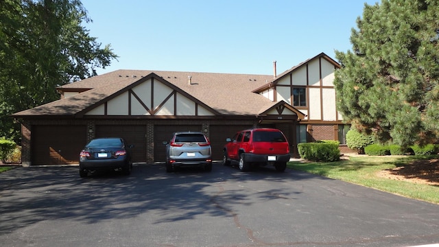 tudor home featuring a garage