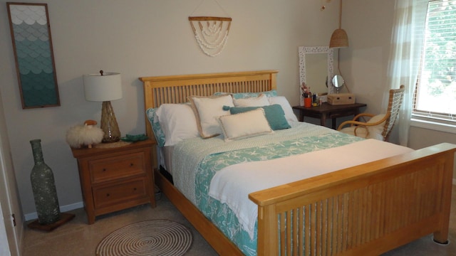 bedroom featuring carpet floors and multiple windows