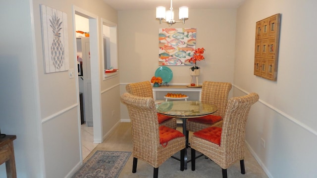 dining room with a notable chandelier