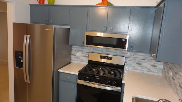 kitchen with decorative backsplash and appliances with stainless steel finishes