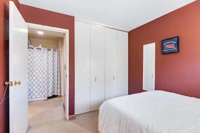 carpeted bedroom featuring a closet