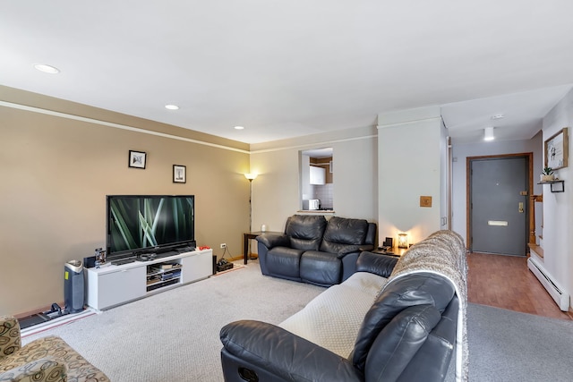 living room featuring hardwood / wood-style floors and a baseboard heating unit